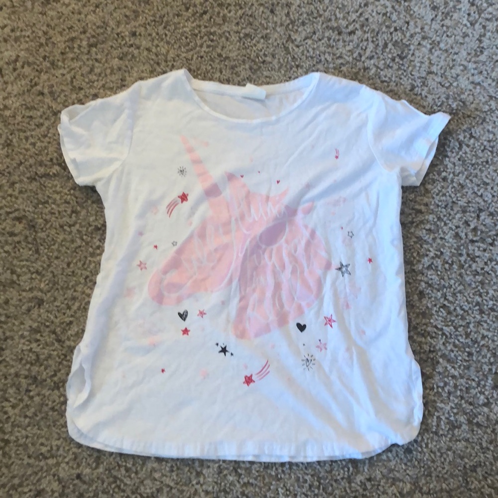 Unicorn shirt with text.